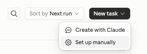 Раскрытая кнопка New task с пунктами Create with Claude и Set up manually